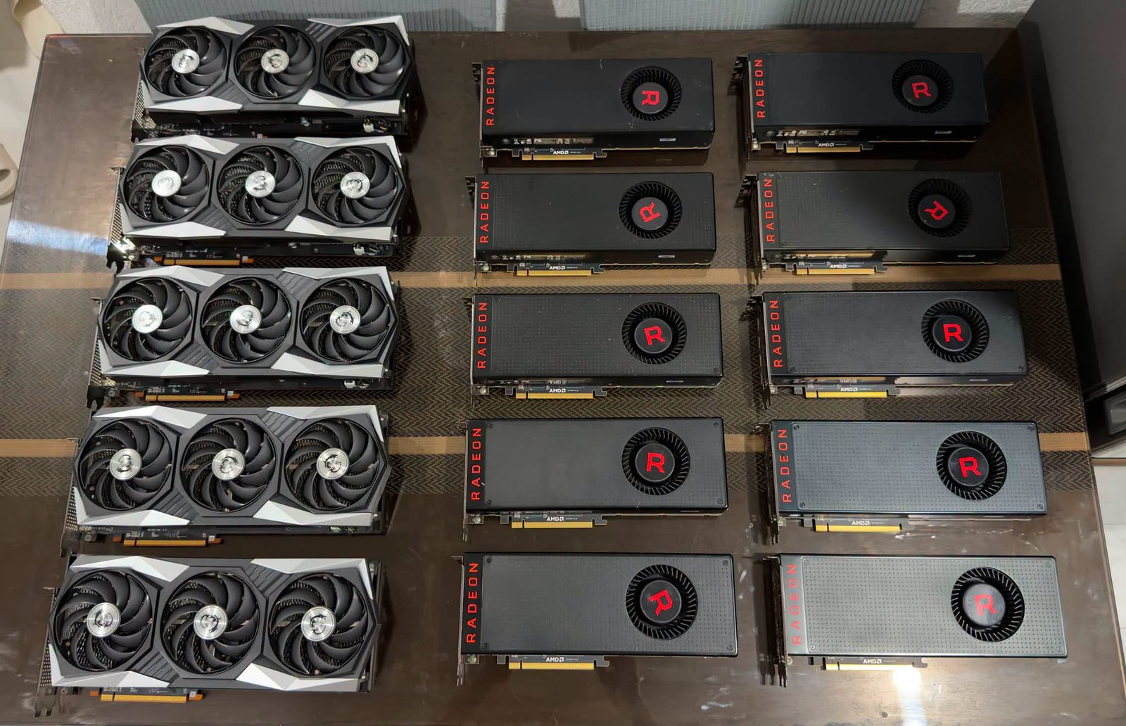 Rows of black and red used graphics cards on the bench