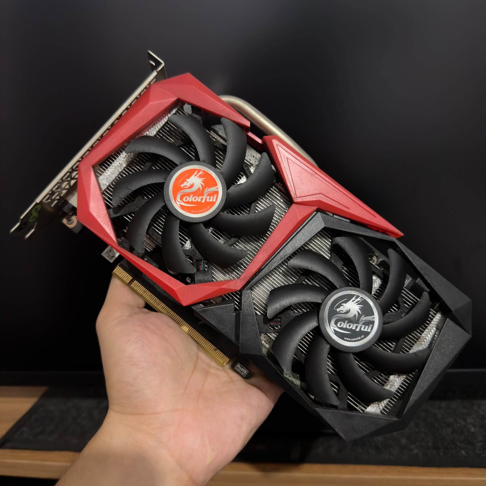 Colorful red dual-fan graphics card before packing