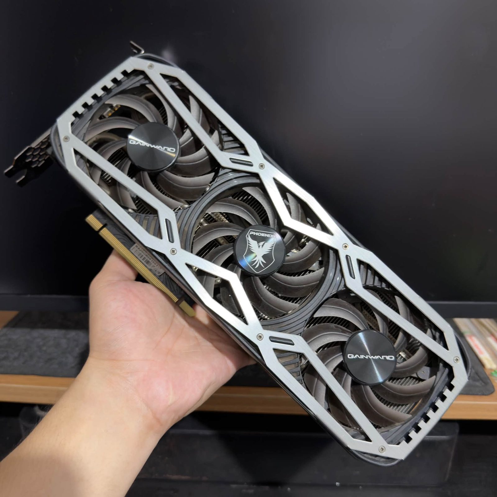 Triple-fan graphics card photographed before delivery